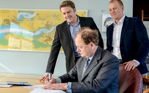 Alec Don, Chief Executive of the Port of Milford Haven (signing) is joined by Dr Gareth Stockman, Managing Director of Marine Power Systems, and Gareth Potter, Project Engineering Manager at Marine Power Systems, to formalise a collaboration agreement for the development of the wave energy converter, WaveSub